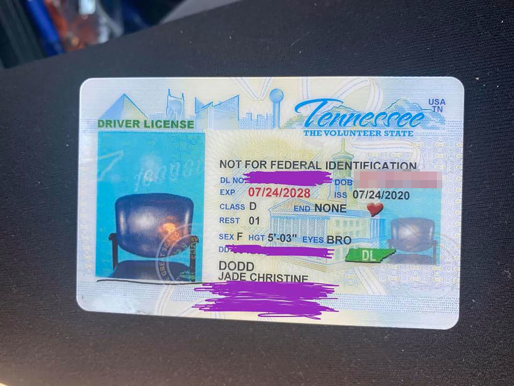 A woman is stunned when her new driver's license came back with a picture of an empty chair